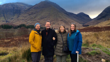 Jason, Doug, Sandy, and Tasha standing in Glen Coe with the mountains in the background