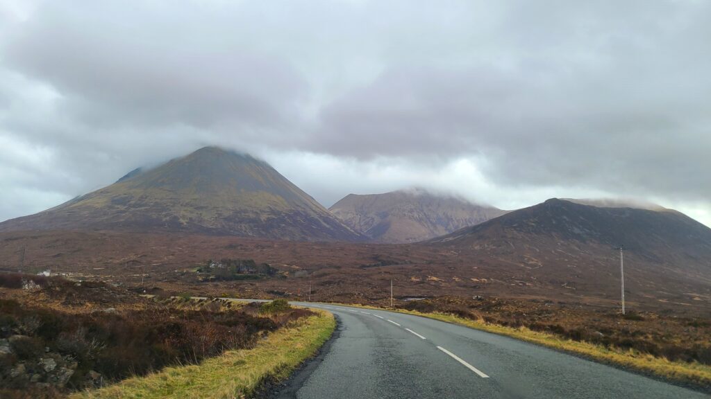 And empty highway into the cloudy mountains in Scotland