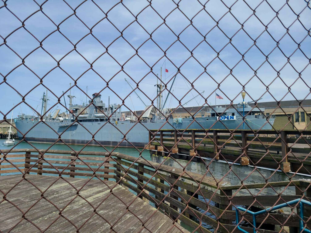 SS Jeremiah O'Brien at Pier 35 in San Francisco behind a chain link fence