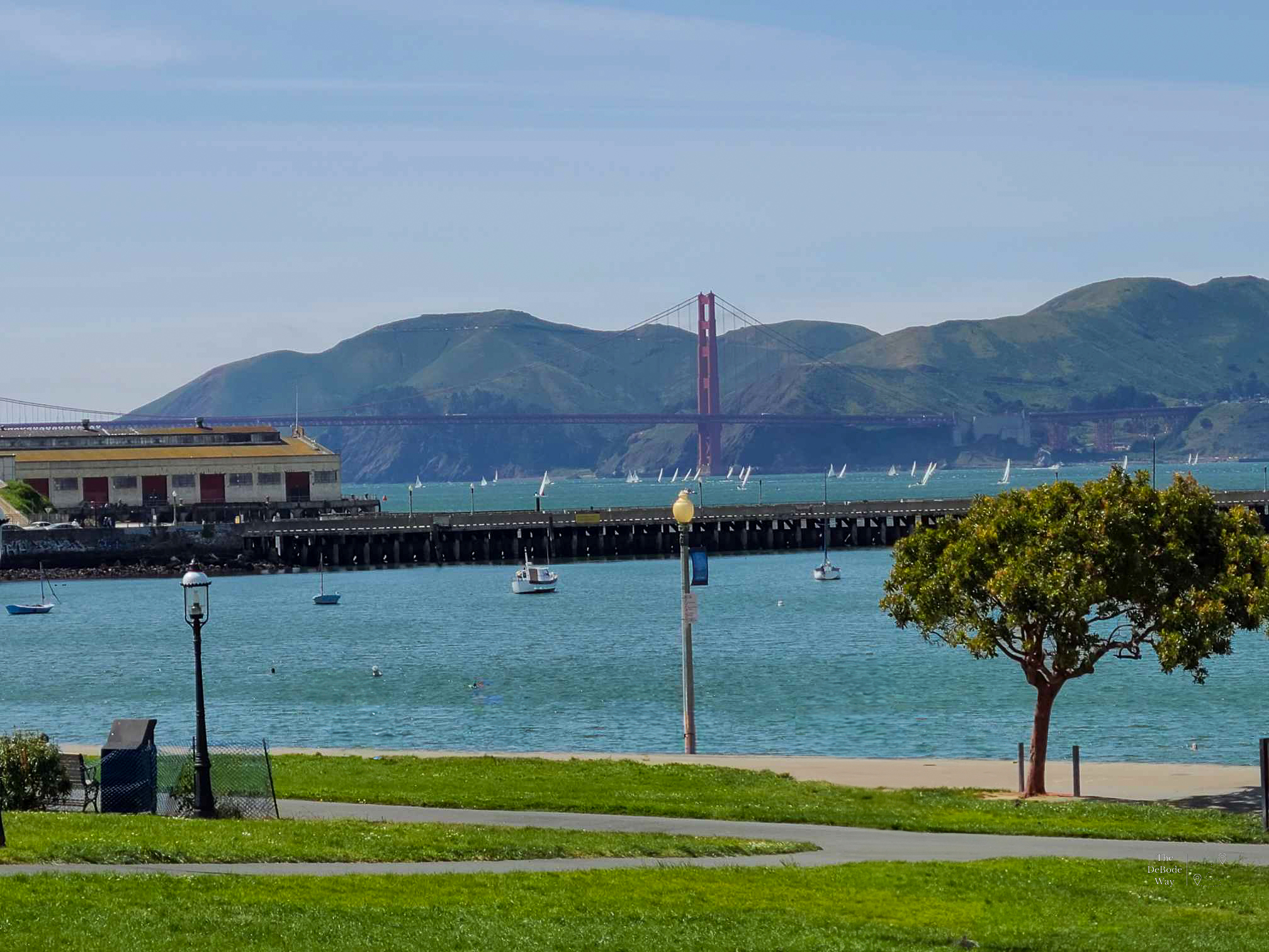 Golden Gate bridge over the bay with the hills in the background
