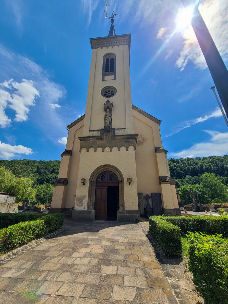 Small catholic church against a blue sky in Born, Luxembourg