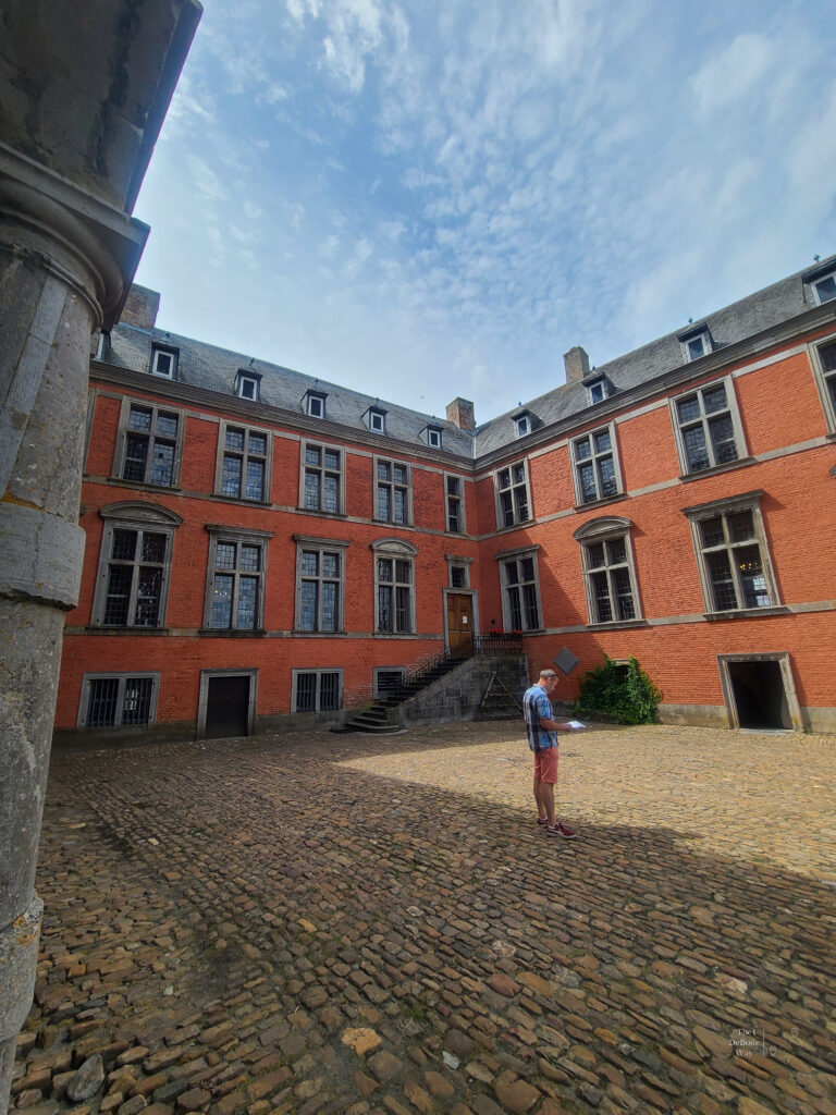 Red brick buildings of the inner courtyard of Chateau de Lavaux-Sainte-Anne