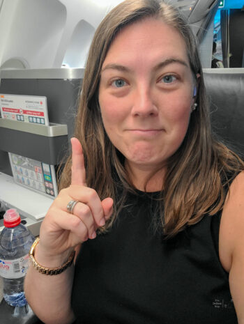 Tasha is sitting in her upgraded business class on United Airlines' partner Air Canada