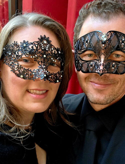 Tasha and Jason in New York City in masquerade masks and black tie