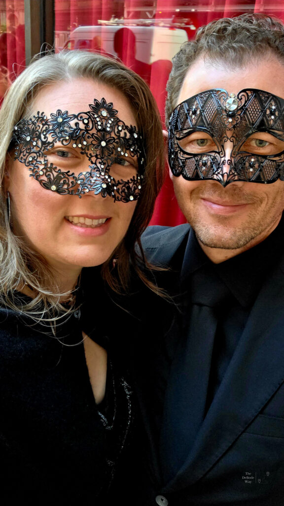 Tasha and Jason in masquerade masks and black tie in New York City