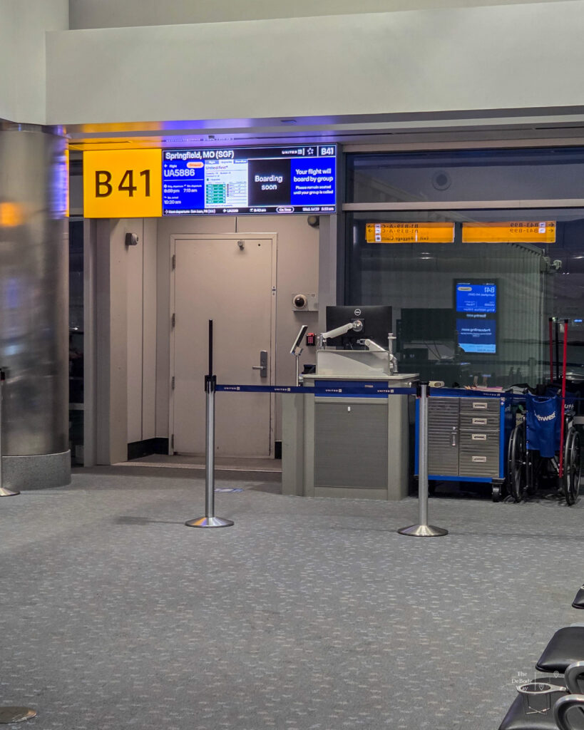 The board at gate B41 announced our upgraded seats the next morning, despite it still being empty of crew.